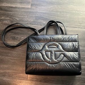 The Telfar Medium Puff Shopper Black is a highly sought-after bag. Lightly used.